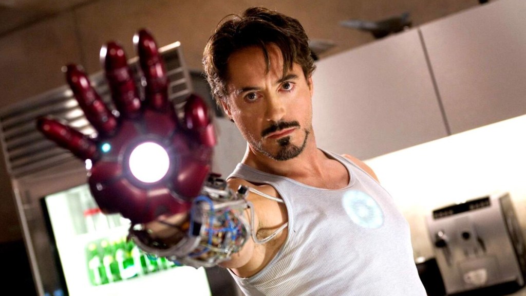 Robert Downey Jr.'s Tony Stark in 2008's Iron Man testing out the hand repulsor.